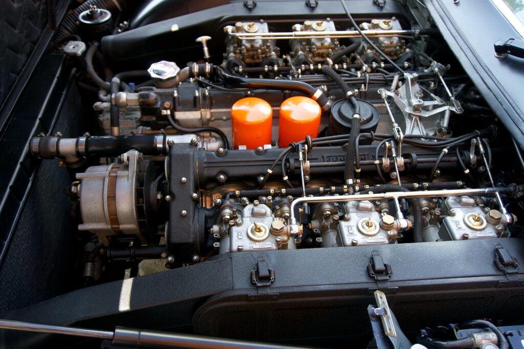 A modified car engine bay to highlight improving a car's performance.