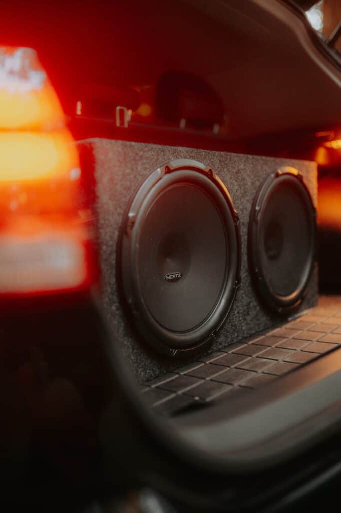 close up of the subwoofers of a car