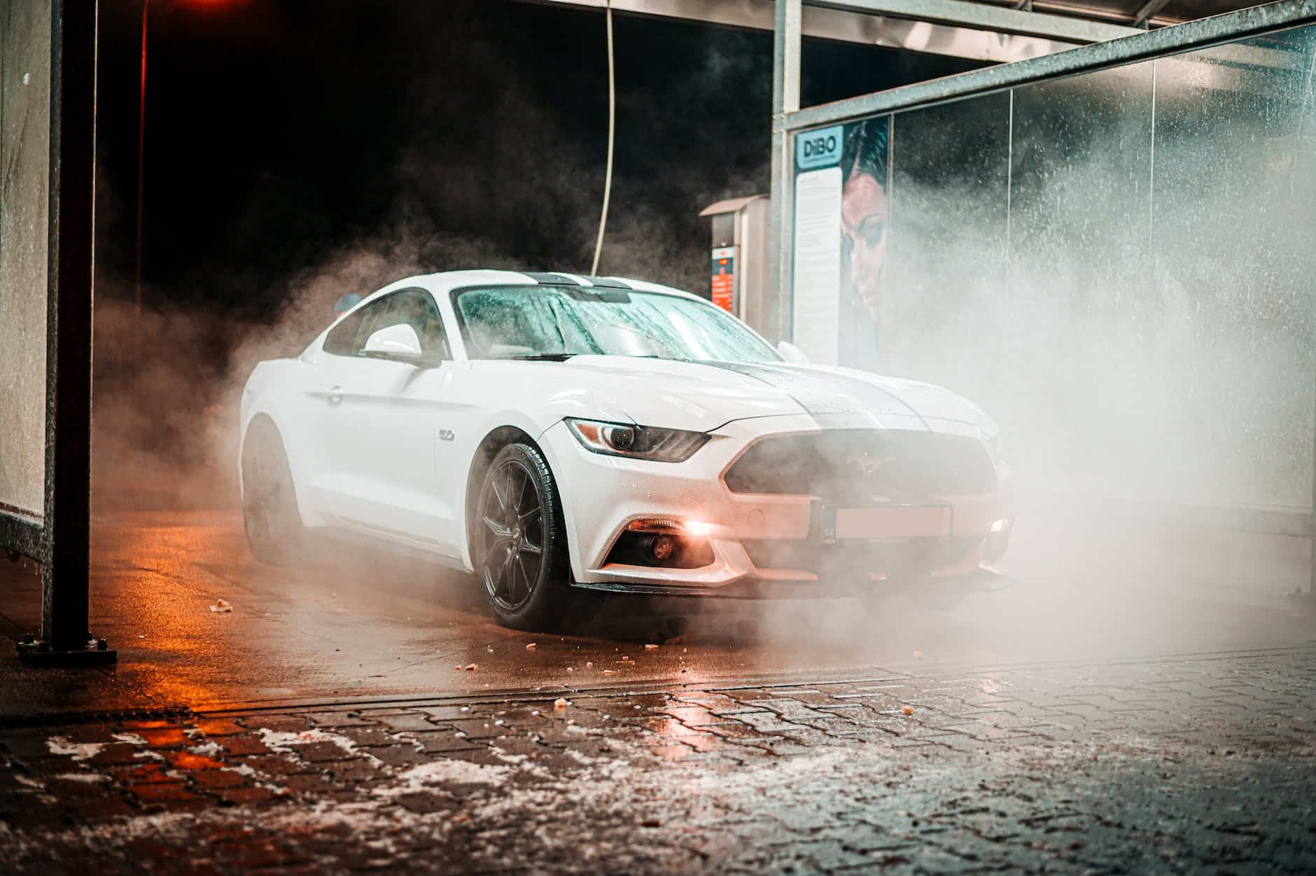 parked white coupe during night