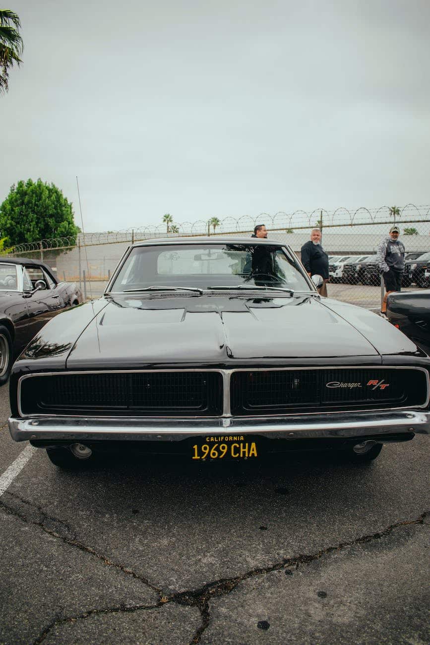 a vintage dodge charger on a parking lot