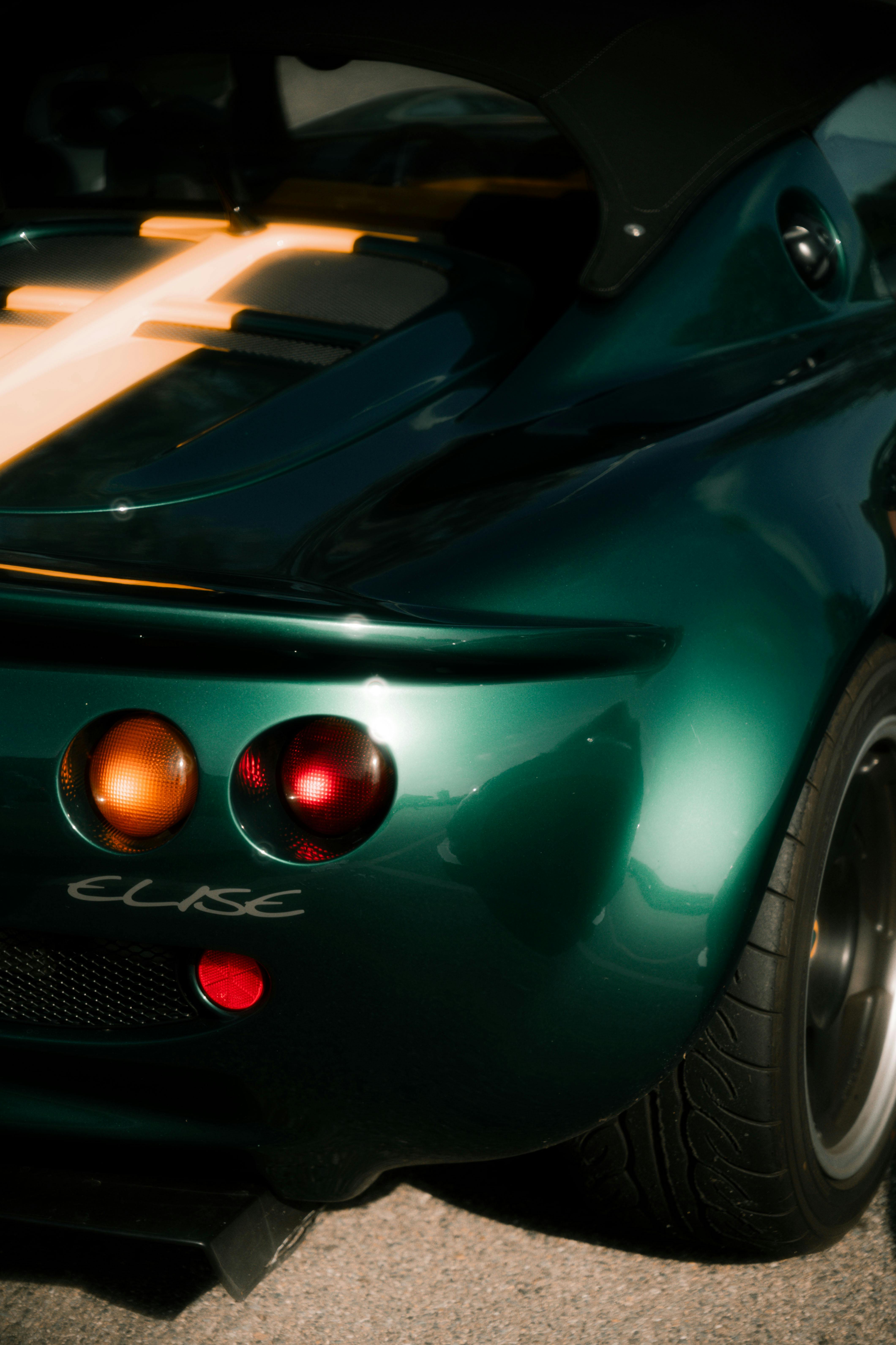 a green lotus elise sports car