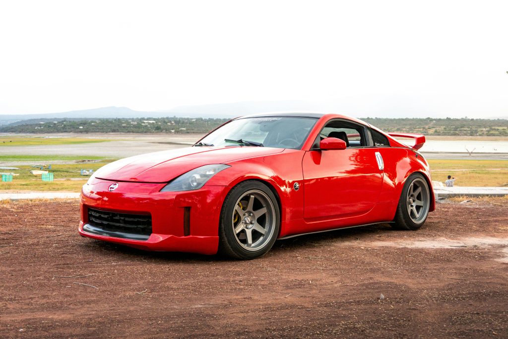 A red nissan 350z highlighting a premier budget jdm car